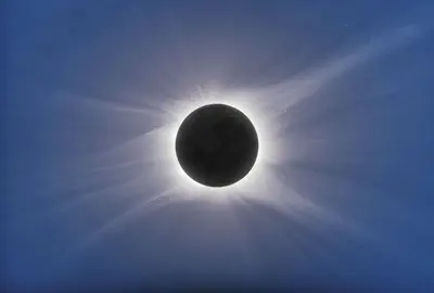 photo of a white ring of sun on a black background