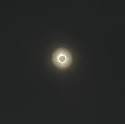 photo of a white ring of sun on a black background