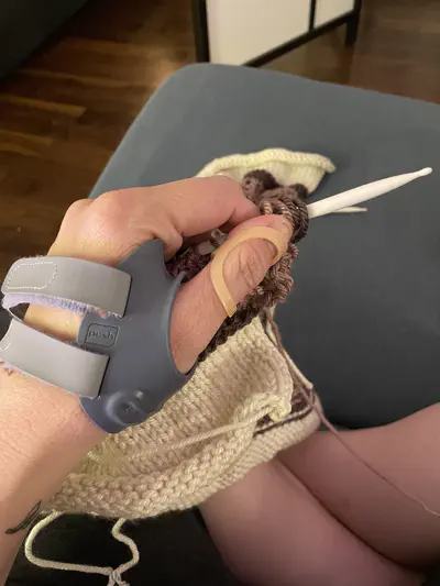 my stupid backwards thumb contained in a CMC thumb brace and an Oval-8 splint